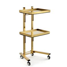 a gold serving cart with three shelves on wheels