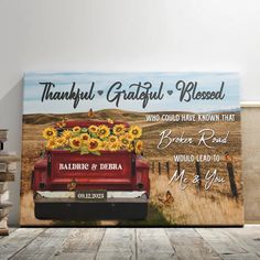 a red truck with sunflowers on the back