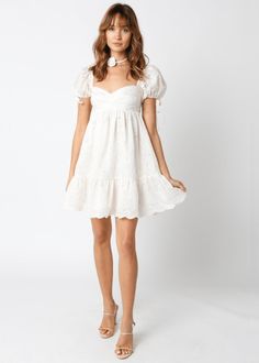 Nothing says chic and elegant like the Tate Cream Eyelet Puff Sleeve Mini Dress! Cream eyelet lace fabric forms a puff sleeve babydoll dress with a sweetheart neckline and a tiered, scalloped hem. Features ties at the sleeves. Lined. DETAILS & FIT Short Babydoll Bodice. 80% Tencel, 20% Polyester. Lining: Cotton Machine wash cold. Imported. SHIPPING & RETURNS Orders are processed within 1-2 business days. Packages are shipped out Monday-Friday, holidays are excluded. Priority, Priority Mail Expre Lace Dress With Ruffle Hem And Sweetheart Neckline, Feminine Lace Dress With Sweetheart Neckline And Ruffles, Chic Spring Puff Sleeve Dress With Lace Trim, Chic Puff Sleeve Dress With Lace Trim For Spring, Lace Puff Sleeve Dress For Garden Party, Fitted Lace Dress With Puff Sleeves, Lace Dress With Puff Sleeves For Garden Party, Summer Puff Sleeve Dress With Lace Trim, Chic Summer Puff Sleeve Dress With Lace Trim