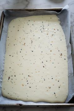 a metal pan filled with batter on top of a counter