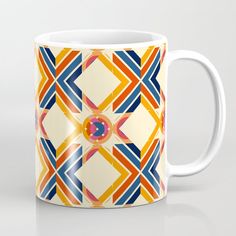 a coffee mug with an abstract design on it