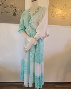 This light weight Sari dress is elegant with attention to detail from the tassels on the ties to the beaded neck. Perfect for brunch, church and wine tours! Dress is 100% polyester with 2 light weight layers making up the dress. Beaded front neckline with tassel ties around the waist and tassel ties in the back. One size fits most (0-12) Beaded neck line Tassel ties Double layer skirt Spring Maxi Dress With Back Tassel Tie-up, Spring Beach Cover-up Dress With Tassels, Bohemian Maxi Dress With Tie Waist, Spring Boho Maxi Dress With Back Tassel Tie-up, Bohemian Tiered Maxi Dress With Tie Back, Summer Beach Midi Peasant Dress, Spring Bohemian Tie-back Dress, Bohemian Maxi Dress With Tie Waist For Brunch, Peasant Style V-neck Beach Dress