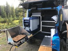 an outdoor kitchen in the back of a truck