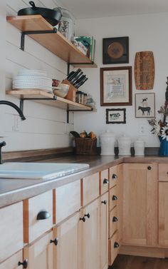 the kitchen is clean and ready for us to use it's shelves are open