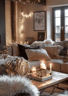 a living room filled with lots of furniture next to a window covered in lights and blankets