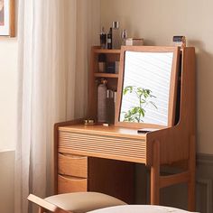 a wooden desk with a mirror and stool