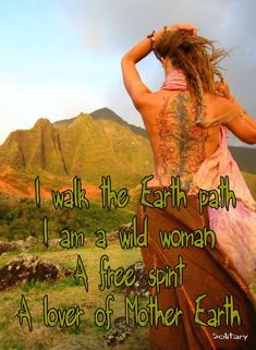 a woman standing on top of a lush green hillside with mountains in the background and text that reads, i walk the earth path i am a wild woman a free spirit