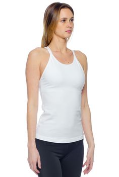 Elevate your basics with the Hard Tail Double Cross Tank. Featuring a White hue, with a high cut neckline, and a double cross design in back, this tank boasts chic style and freedom of movement. Made of a soft, flexible cotton/lycra blend fabric, with a built-in shelf bra, this tank offers comfortable style for in and out of the studio. Wear this tank for yoga, barre, gym sessions, or for everyday style. Description: High cut neckline, for full coverage. Semi-fitted. Pre-shrunk. Built-in shelf b