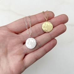 An incredible, realistic full moon is etched on sterling silver and hangs from a delicate, yet sturdy chain. This sweet little moon makes the perfect gift! Just a little bit larger than our original tiny moon! The pendant is available in sterling silver with a sterling silver chain, or gold vermeil (a thick layer of 14k gold plating over sterling silver), with 14k gold filled chain. Chain options, listed from top to bottom: Satellite chain Paper clip chain Rolo chain This moon pendant measures 1 Silver Moon Charm Necklace For Gift, Dainty Silver Moon Charm Necklaces, Dainty Silver Moon Charm Necklace, Sterling Silver Moon Charm Necklace For Gift, Silver Charm Necklace With Moon Charm As Gift, Silver Charm Necklace With Moon Charm For Gift, Minimalist Sterling Silver Coin Necklace With Delicate Chain, Silver Moon Charm Necklace, Sterling Silver Moon Charm Necklace For Everyday