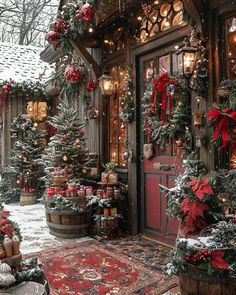 christmas decorations are on display in front of a house with red and green wreaths