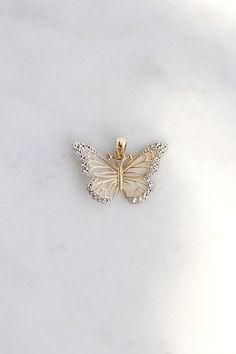 Give her the gift of wings with this beautiful butterfly necklace. DETAILS - 14k yellow gold butterfly with rhodium plating VARIATIONS If you require any variation of this style (a different style chain, longer chain, etc.) feel free to message us. We will do our best to accommodate you. Additional costs may apply depending on the variation. POLICY We do accept returns on this item minus a $25 restocking fee. Return shipping is the responsibility of the buyer. Any expedited shipping will not be Butterfly-shaped Yellow Gold Jewelry With Diamond Accents, Butterfly Shaped Yellow Gold Diamond Jewelry, Yellow Gold Butterfly Diamond Jewelry, Diamond Butterfly Charm Jewelry, Butterfly Shaped Jewelry With Diamond Accents For Gifts, Fine Jewelry Butterfly Necklace With Diamond Accents, White Diamond Butterfly Charm Necklace, 14k White Gold Butterfly-shaped Jewelry, 14k White Gold Butterfly Jewelry