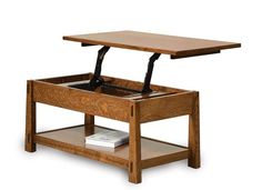 a wooden table with an open drawer underneath it and a book on the bottom shelf