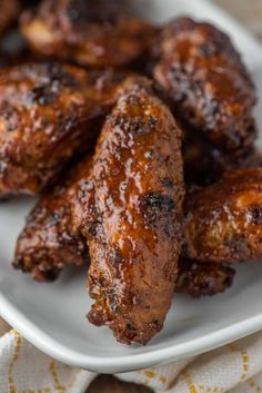 grilled honey lemon pepper wings on a white plate with the title text overlay