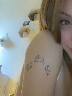 a girl with a tattoo on her arm