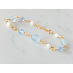 The Blue Glass And Pearl Bracelet Is Composed Of Frosted Glass Beads, White Freshwater Pearls And Gold Non-Tarnish Copper Wire. It Measures 7.5" And Has A Handmade Hook Closure. Elegant Blue Jewelry For Beach, Blue Glass Beaded Bracelets For Beach, Elegant Blue Glass Bracelets, Elegant Blue Glass Bracelet, Blue Jewlery, White Freshwater Pearl, Bracelets Handmade Beaded, Jewelry Diy, Frosted Glass