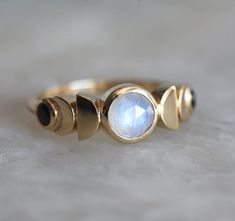 Moonstone Moon Phase Ring with Spinels 14k or 18k Solid Gold | Etsy Elegant Round Moonstone Ring With Moon Phase, Mystical Moonstone Ring With Moon Phase, Spiritual Crescent Moonstone Ring With Moon Phase, Wedding Crescent Moonstone Ring With Moon Phase, Celestial Rings With Moon Phase, Moonstone Moon Phase Ring, Moonstone Promise Ring With Moon Phase, Celestial Moon Phase Rings, Celestial Moonstone Ring With Moon Phase For Anniversary