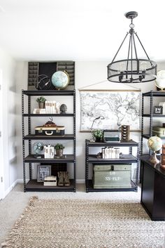 a living room filled with lots of furniture and shelves full of books on top of them