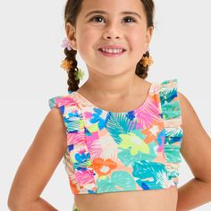 Add sweet style to your toddler's swimwear collection with the Ruffle Bikini Set from Cat & Jack™. This two-piece bikini set includes a sleeveless bikini top and a bikini bottom, both with a printed pattern and ruffle detailing along the sides for a stunning appeal. Tailored from recycled polyester fabric with spandex and full lining, this full-coverage bikini set offers comfort all the time, whether they're diving, playing in the sand or indulging in other activities. Best of all, they'll stay Toddlers Swimwear, Striped Tankini, Swimsuit Set, Recycled Polyester Fabric, Tankini Set, Solid Leggings, Swimsuit Shops, Sweet Style, Swimwear Collection