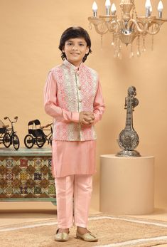 **Specifications : Please visit our brand store for more collection. StitcheryUK.etsy.com  If you need Father and Son same outfits we can make by customised for that kindly message me. Top Details Color- Peach Multi, Fabric - Soft Blended Embroidered Fabric Bottom Details Color- Peach, Fabric - Blended Slik , Style - Elastic Pant Package Include :INCLUDES 1 BANDI, 1 KURTA AND 1 PANT. Turban ,Mojari And Other Accessories Are Not Sold Along With The Dress. CARE: DRY CLEAN ONLY *Additional Informat Anarkali Style Embroidered Nehru Jacket For Reception, Pink Bandhgala With Zari Work And Long Sleeves, Pink Long Sleeve Bandhgala With Zari Work, Festive Pink Long Sleeve Bandhgala, Fitted Bollywood Style Pink Nehru Jacket, Designer Pink Nehru Jacket With Zari Work, Embroidered Pink Sherwani For Eid, Festive Pink Nehru Jacket With Resham Embroidery, Pink Embroidered Sherwani For Eid