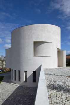 an unusual building that looks like it is made out of concrete