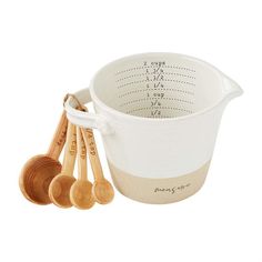 measuring cup with wooden spoons and measuring cups