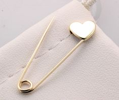 14k Yellow Gold Safety Pin Heart Shape Brooch Handmade in USA Yellow gold safety pin made of solid 14K gold 1.25'' long The jewelry we make is made with recycled and re-refined environmentally responsible precious metals. Please note these pins are not mass produced or cast , each and every one is handmade in our shop with care and great attention to detail. 14K Solid Gold Pin's are made in USA and are of the highest quality. They are nicely polished and stamped for authenticity. Gold Safety Pin Shaped Brooch, Gold Safety Pin Shaped Brooch Jewelry, Gold Safety Pin Lapel Brooch, Gold Safety Pin Lapel Pin Gift, Gold Safety Pin Lapel Pin For Gift, Gold Safety Pin Jewelry For Wedding, Valentine's Day Gold Jewelry Brooch, Valentine's Day Gold Brooch Jewelry, Valentine's Day Gold Brooch