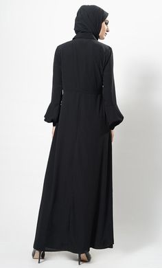 Featuring a casual everyday shirt style abaya dress in nida base with hidden overlapping button closure placket at the centre front. Its a simple muslimah abaya with bishop style sleeves and A line silhouette perfect to be worn daily for informal ocassions.FIT : Relaxed fit.COMPOSITION : Nida.CARE : Dry clean only. Long Sleeve Modest Abaya With Modesty Panel, Modest Long Sleeve Abaya With Modesty Panel, Modest Maxi Length Abaya For Fall, Fall Modest Maxi Length Abaya, Fall Season Modest Maxi Length Abaya, Long Sleeve Abaya With Modesty Panel For Fall, Maxi Length Abaya For Fall Workwear, Fall Long Sleeve Abaya With Modesty Panel, Fall Workwear Abaya In Maxi Length