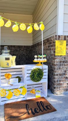 an outdoor lemonade stand is decorated with lemons