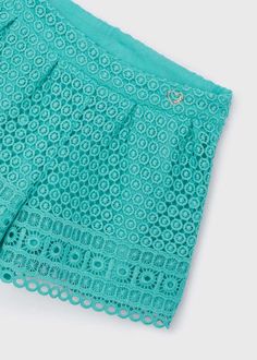 Upgrade your child's wardrobe with the Mayoral Guipure Lace Shorts. Made with 100% polyester, these stylish shorts feature a delicate guipure lace outer layer. The soft lining, composed of 80% polyester and 20% cotton, ensures comfort and breathability for your young fashionista. Add a touch of elegance to any outfit with these pretty lace shorts. Green Lace Bottoms For Spring, Spring Cotton Bottoms With Crochet Lace, Spring Cotton Crochet Lace Bottoms, Spring Lace Shorts With Crochet Trim, Lace Shorts With Crochet Trim For Spring, Lace Bottoms With Crochet Trim In Short Style, Short Lace Bottoms With Crochet Trim, Short Crochet Lace Bottoms For Spring, Spring Crochet Lace Short Bottoms