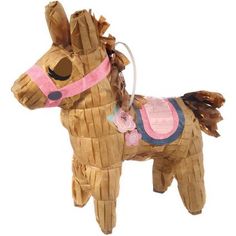 a paper mache horse is shown on a white background with pink trimmings