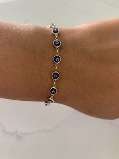 14K Gold Evil Eye Bracelet , Blue Evil Eye, 4mm Eye Diameter, 7.5" Length, 2.4 Grams Spring Ring Clasp, Layering, Stackable, Gold Bracelet Item Number:ADR-ACE-2500 Metal:14k Yellow Gold    Clasp Type : Spring Ring Clasp weight: 2.4 Grams    7.5" Length WIDTH: 4 MM We offers Beautiful Jewelry, at Affordable Prices! Remember, this is a risk-free purchase, If for any reason this does not live up to your expectations, you are backed by a rock-solid, 14 days 100% Money Back Guarantee HAVE ANY QUESTIONS CONTACT US All International Buyers are responsible for any custom & duties charged by their destination country. Evil Eye Jewelry Bracelet, Evil Eye Jewellery, Gold Evil Eye Bracelet, Bracelet Evil Eye, Gold Armband, Bracelet Blue, Blue Evil Eye, Eye Bracelet, Rock Solid