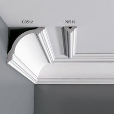 the corner of a ceiling with white trim