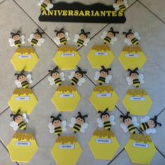 a bunch of bees that are on top of some yellow hexagonals with name tags