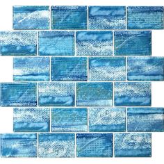 blue glass tile backsplash that looks like it has been painted on the wall