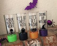 halloween themed glasses on top of bricks