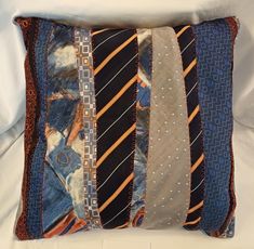 a decorative pillow with ties on it