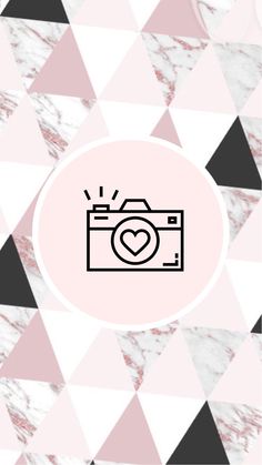 a camera with a heart on it and triangles in the background