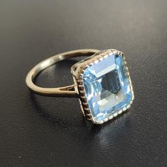 This stunning ring is set in 14k Solid Yellow Gold with Natural Sky Blue Topaz with utmost precision. It is an unique statement gemstone ring for nearly every occasion and is completely hassle-free jewelry. ITEM DETAILS * GEM: Sky Blue Topaz * GEM SIZE: 10X12mm * GEM SHAPE: Octagon * GEM WEIGHT: 7.15 carats * Gold Purity: 14KT * Gold Weight: 2.27 gram * Total Weight of the Ring: 3.70 gram The Gold purity is guaranteed and it comes with authentic 14KT gold hallmark. Since my items are handmade, t Classic Light Blue Topaz Ring For Formal Occasions, Classic Light Blue Topaz Ring For Anniversary, Light Blue Topaz Ring For Formal Occasions, Formal Aquamarine Topaz Birthstone Ring, Formal Light Blue Topaz Ring Fine Jewelry, Yellow Gold Diamond Cut Blue Topaz Ring, Blue Topaz Ring With Prong Setting In 14k Gold, Heirloom Blue Topaz Rings In Blue, Heirloom Blue Topaz Ring With Diamond Cut