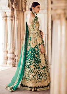 Pakistani Bridal Lehnga in Emerald Green for Wedding is Emblazoned with Pretty gold color Work and perfect choice for Traditional bride. Shirt is long in length and open style looking so beautiful. Shirt: Shirt in emerald green color is embellished with full sleeves open shirt heavily embroidered with gold dabka, naqshi, beads and sequin hand work. Cutwork on shirt and sleeve hem with drop stone finishing. Lehnga: Lehnga in bottle green color is embellished with gota booti chan and gold worked b Green Color Wedding, Front Open Gown, Mehendi Dress, Green Wedding Dresses, Bridal Dupatta, Bridal Shirts, Muslim Wedding Dresses, Wedding Lehenga Choli, Gown Elegant