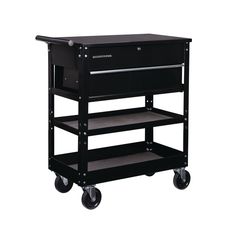 This sturdy, all steel, tool cart has a large drawer and generous top compartment, making it a versatile mobile workstation. With over 4847 cu. in. storage capacity this mobile tool cart keeps the tools and supplies you need close at hand while you work. Heavy-duty carbon steel construction High gloss powder-coated finish and rust resistant fasteners Ball bearing slides on drawer for easy opening Lockable drawer with keys Two swivel casters Lid opens 90° Black Folding Side Tray sold separately Mobile Tool Cart, Tattoo Furniture, Cricut Storage, Tattoo Table, Tattoo Studio Design, Bulk Storage, Home Beauty Salon, Wire Crate, Mobile Workstation