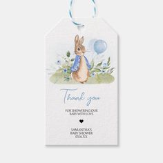 a baby shower gift tag with an image of a bunny holding a blue balloon in the air