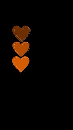 two hearts are on top of each other in the middle of a black background with an orange border