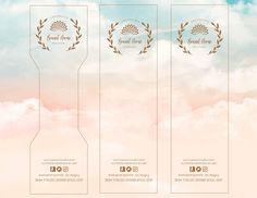 three wine bottle labels in front of a cloudy sky