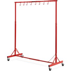 a red garment rack with four hooks on wheels and two hangers attached to it