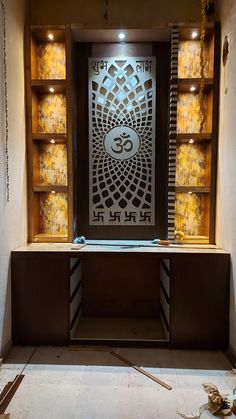 the inside of a room that is being remodeled with wooden shelves and decorative artwork on the wall