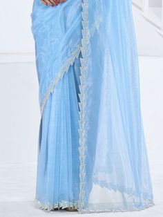 This saree is crafted from luxurious organza material in a captivating sky-blue color with intricate Swarovski work all over. The saree is adorned with a heavy handwork border, adding a touch of sophistication and elegance to the overall look. Paired with a matching organza blouse featuring zircon work, this ensemble is perfect for receptions, parties, festivals, or any special occasion.
This saree includes its gorgeous sky-blue color that exudes charm and elegance. The Swarovski work all over t Festive Blue Wedding Pre-draped Saree, Designer Blue Tissue Silk Pre-draped Saree, Blue Tissue Silk Pre-draped Designer Saree, Blue Tissue Silk Pre-draped Saree For Designer Wear, Blue Organza Pre-draped Saree With Dupatta, Blue Tissue Silk Blouse Piece For Party, Blue Bollywood Style Pre-draped Tissue Silk Saree, Festive Blue Tissue Silk Blouse Piece, Blue Tissue Silk Saree For Party