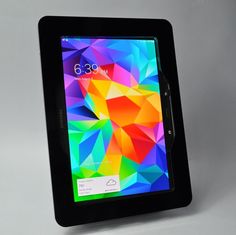 an image of a tablet on display with the screen turned upside down and colorful colors