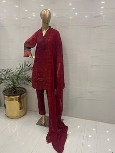 Fabric:   lawn   3 pc shirt trouser dupatta  Shirt: Embroidered Chikankari   shirt  beautifully embroidered chicken kari daman printed embellished sleeves , printed  back  embroidered  chiffon duptta  Plain trouser Measurement  🧵  medium 👗  Shoulder: 15  Chest: 40 Waist: 46 Sleeves length: 18 Shirt length: 38  Aramhole: 9.5  Trouser length: 37  Large 👗  Shoulder: 15  Chest: 46  Waist: 49 Sleeves length: 19 Shirt length: 40  Aramhole: 10.5  Trouser length:  37 Red Lawn Suit With Sheer Dupatta For Eid, Anarkali Lawn Suit With Sheer Dupatta In Red, Red Anarkali Lawn Suit With Sheer Dupatta, Red Unstitched Sharara With Naqshi Detailing, Red Semi-stitched Lawn Suit With Sheer Dupatta, Semi-stitched Red Lawn Suit With Sheer Dupatta, Red Anarkali Unstitched Suit With Naqshi Detail, Red Anarkali Unstitched Suit With Naqshi, Red Designer Lawn Suit With Sheer Dupatta