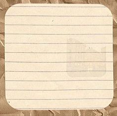 a piece of paper that is on top of some brown paper with writing in it