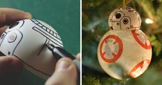 a star wars ornament hanging from a christmas tree next to an ornament shaped like a droid